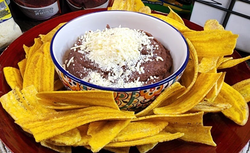Mama Lycha plantain chips with a bean dip bowl