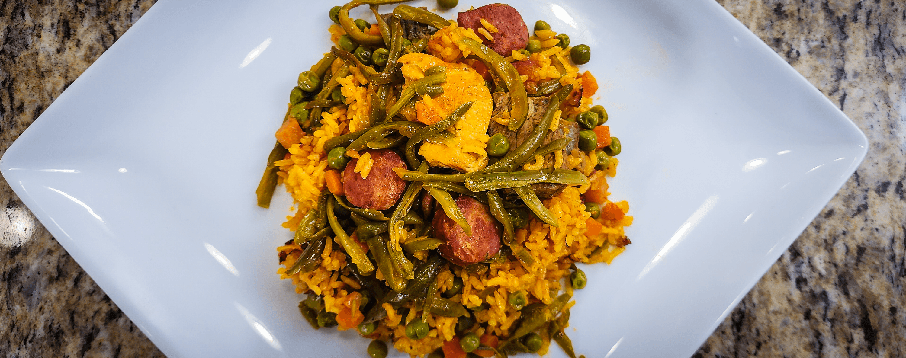 Paella with Colombian chorizo and vegetables.