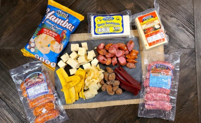 cheese and meat board with plantains and chorizo cojutepeque (sausage)